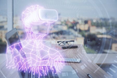 Computer on desktop with AR theme icon. Multi exposure. Concept of augmented reality.の写真素材