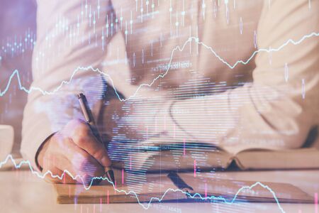 Financial trading chart doble exposure with man desktop background. Concept of success.