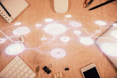 Double exposure of social network theme drawing over table with phone. Top view. People connecting concept.の写真素材