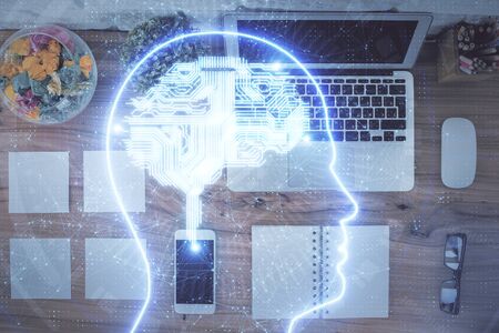 Double exposure of brain drawing hologram over topview work table background with computer. Concept...
