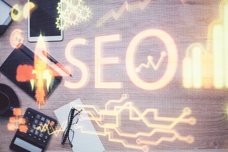 Double exposure of SEO drawing and table top veiw. Concept of search optimization.の写真素材