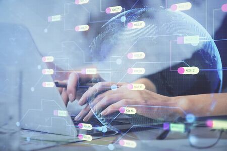 Multi exposure of woman hands working on computer and data theme hologram drawing. Tech concept.の写真素材