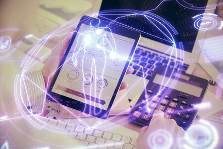 Double exposure of mans hands holding and using a phone and education theme drawing.の写真素材