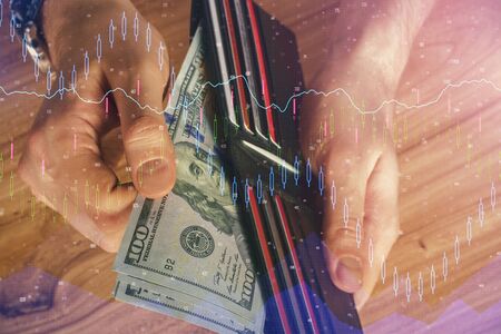 Multi exposure of forex graph drawing hologram and USA dollars bills and man hands. Technical Analysis concept.の写真素材