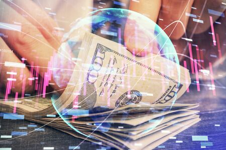 Multi exposure of forex graph drawing hologram and USA dollars bills and man hands. Technical Analysis concept.の写真素材