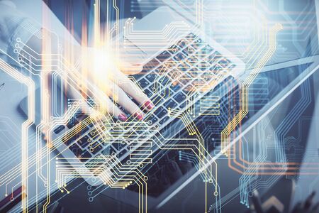 Double exposure of woman hands working on computer and world map hologram drawing. International...