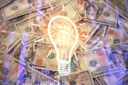 Double exposure of light bulb drawing over usa dollars bill background. Concept of idea.の写真素材