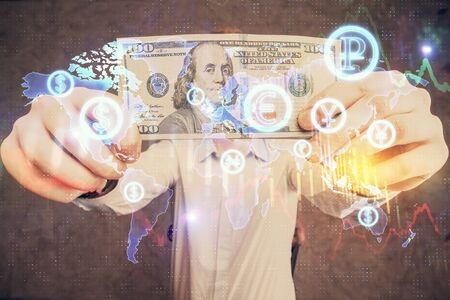 Multi exposure of forex graph drawing hologram and USA dollars bills and man hands. Technical Analysis concept.の写真素材
