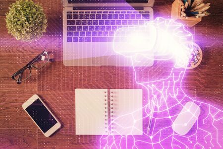 AR hologram drawings over computer on the desktop background. Top view. Multi exposure. Concept of augmented reality.の写真素材