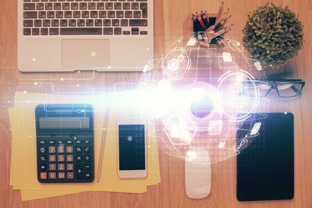 Double exposure of social network theme drawing over table with phone. Top view. People connecting concept.の写真素材