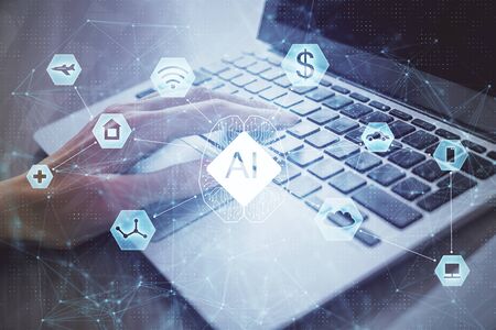 Double exposure of woman hands working on computer and data theme hologram drawing. Tech concept.の写真素材