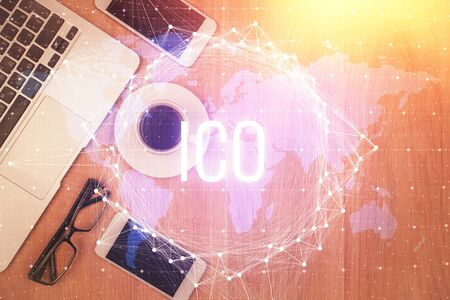 Double exposure of blockchain theme hologram over table with phone. Top view. Crypto technology concept.の写真素材