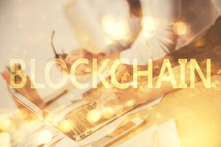 Double exposure of woman hands typing on computer and crypto market theme hologram drawing. Blockchain concept.の写真素材