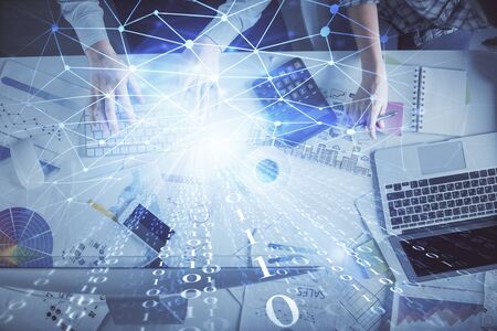 Double exposure of man and woman working together and data theme hologram drawing. Computer...