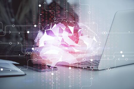 Double exposure of woman on-line shopping holding a credit card and brain hologram drawing. Data...