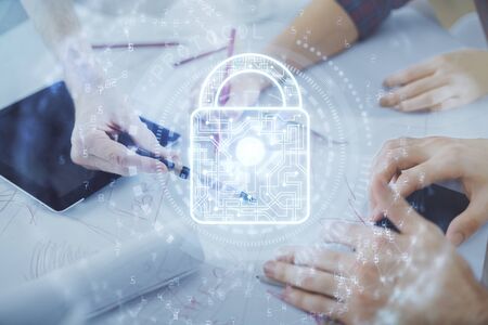 Double exposure of lock hologram drawing and man and woman working together holding and using a...