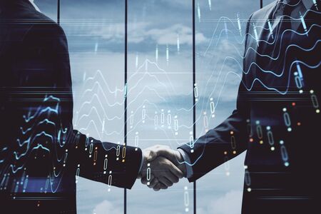 Double exposure of forex graph hologram and handshake of two men. Stock market concept.の写真素材