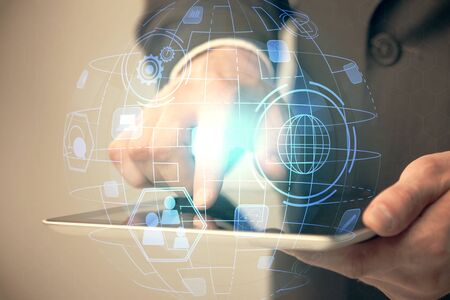 Double exposure of mans hands holding and using a phone and social network theme drawing.