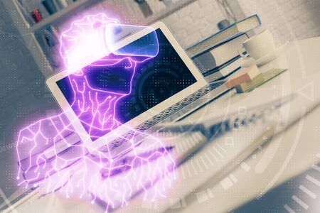 Computer on desktop with AR theme icon. Multi exposure. Concept of augmented reality.の写真素材