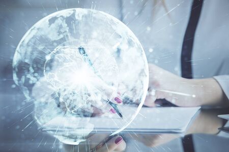 International business hologram over hands taking notes background. Concept of success. Multi exposureの写真素材