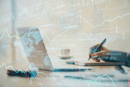 Double exposure of forex chart with man working on computer on background. Concept of market analysis.の写真素材