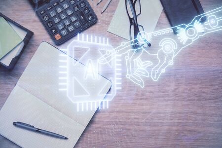 Double exposure of technology theme drawing over work table desktop. Top view. Global data analysis...