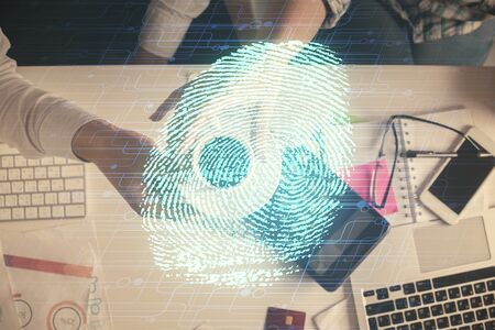 Double exposure of man and woman working together and fingerprint drawing. Computer background. Top...