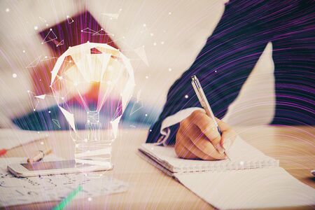 Double exposure of bulb drawing over people taking notes background. Concept of ideaの写真素材