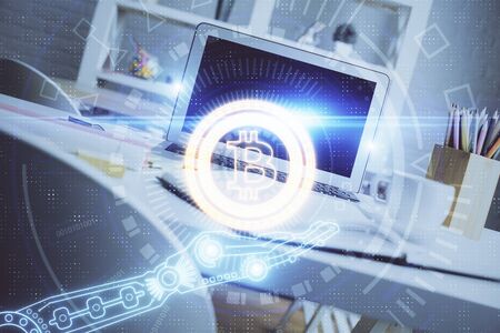 Multi exposure of blockchain and crypto economy theme hologram and table with computer background. Concept of bitcoin cryptocurrency.の写真素材
