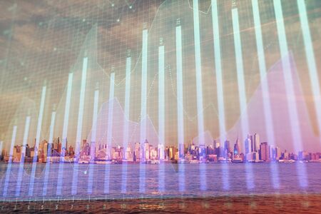 Forex chart on cityscape with skyscrapers wallpaper double exposure. Financial research concept.の写真素材
