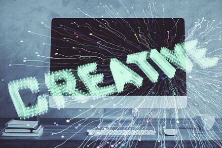 Desktop computer background in office and start up theme hologram drawing. Double exposure. Startup concept.の写真素材