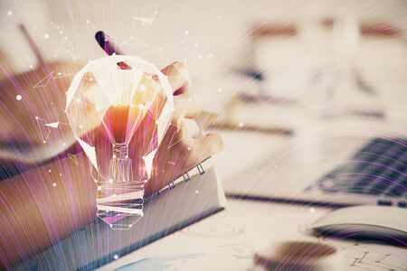 Double exposure of bulb drawing over people taking notes background. Concept of ideaの写真素材