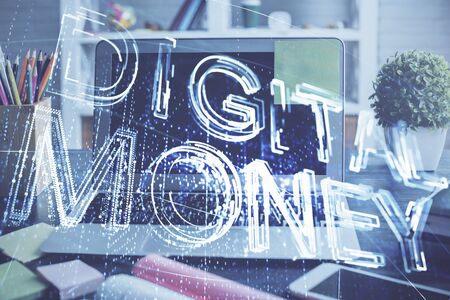 Multi exposure of blockchain and crypto economy theme hologram and table with computer background. Concept of bitcoin cryptocurrency.の写真素材