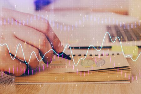 Multi exposure closeup hands with stock market forex graph. Concept of research and analysis.の写真素材