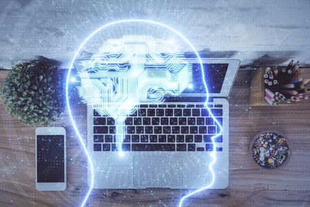 Multi exposure of brain sketch hologram over topview work table background with computer. Concept of...