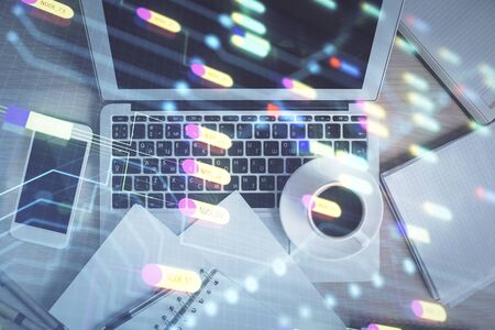 Multi exposure of data theme drawing hologram over topview work desk background with computer. Concept of technology.の写真素材