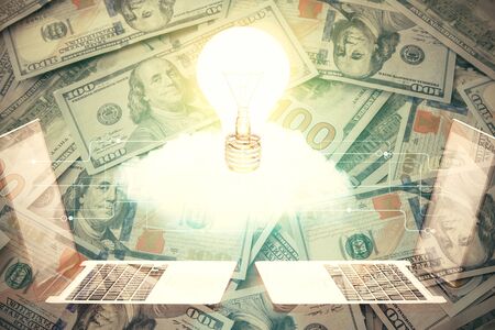 Double exposure of light bulb drawing over usa dollars bill background. Concept of idea.の写真素材