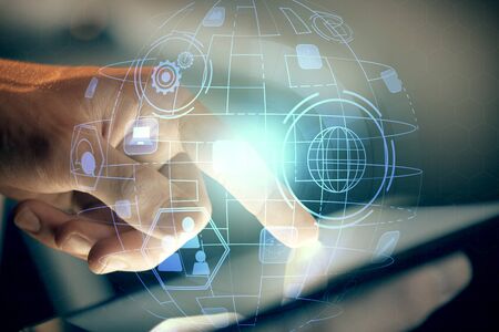 Double exposure of mans hands holding and using a phone and social network theme drawing.