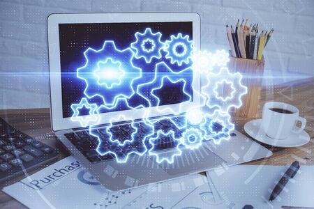 Double exposure of business theme icons and work space with computer background. Concept of success.の写真素材