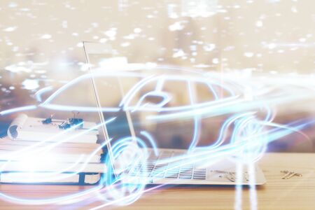 Desktop computer background in office with automobile hologram drawing. Multi exposure. Tech...