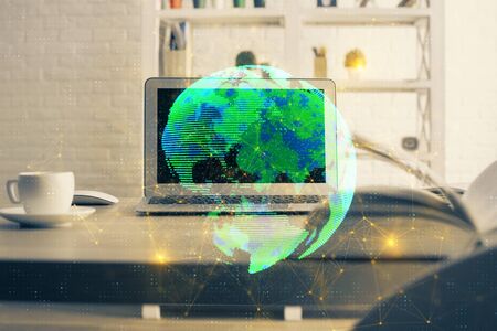 Computer on desktop with social network theme icon. Multi exposure. Concept of international connections.の写真素材