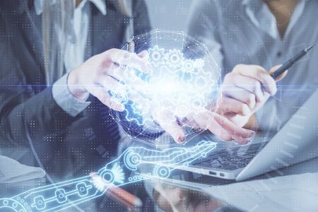 Double exposure of man and woman working together and technology theme drawing hologram. Big data...