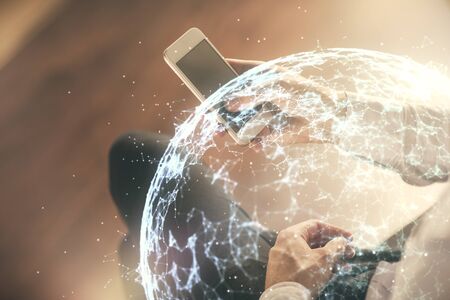 Double exposure of mans hands holding and using a phone and social network theme drawing.の写真素材