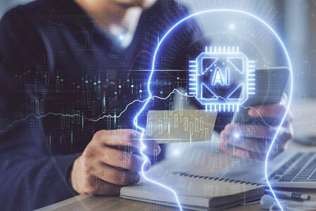 Double exposure of mans hand holding and using a digital device and brain hologram drawing. Data...