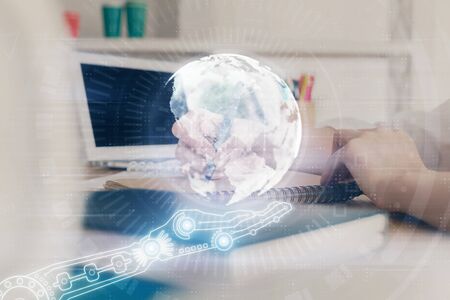 Double exposure of hands making notes with world map hologram and data theme icons. Concept of international network data.の写真素材