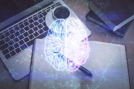 Double exposure of brain drawing hologram over topview work table background with computer. Concept...