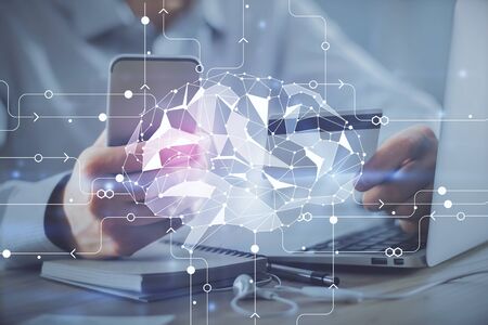Double exposure of man hands typing on computer with credit card and brain theme drawing. E-commerce...