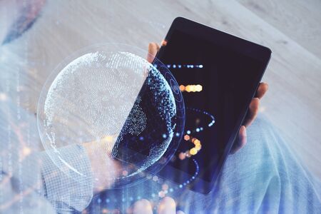 Multi exposure of mans hands holding and using a digital device and map drawing. International business concept.の写真素材