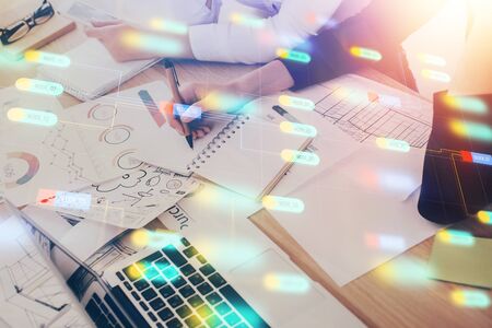 Double exposure of womans writing hand on background with data technology hud. Big data concept.の写真素材