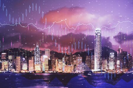 Double exposure of forex chart drawings over cityscape background. Concept of success.の写真素材